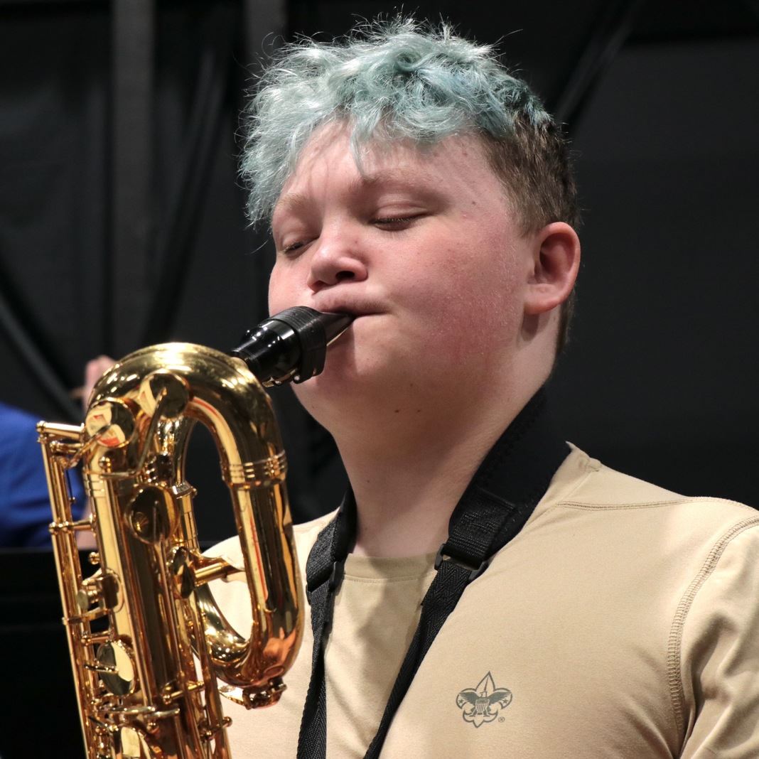 A student plays alto saxophone 